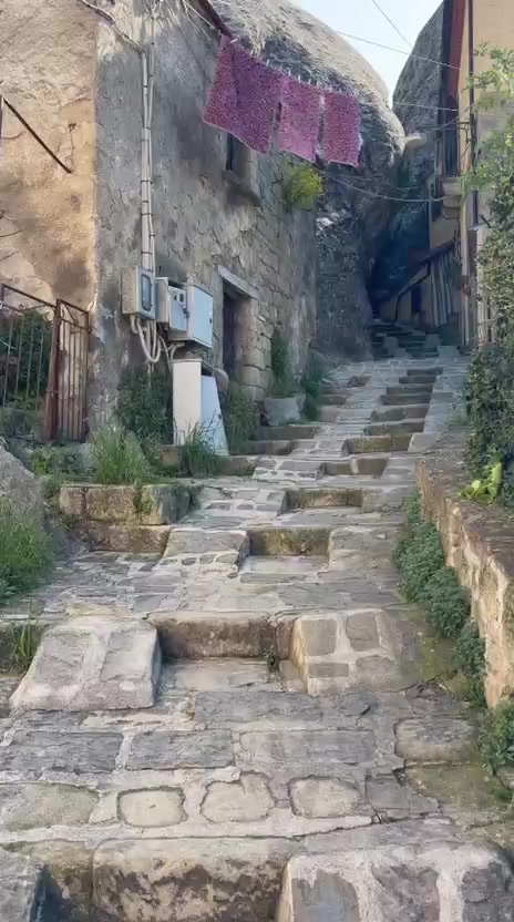 Walking the old streets of Castelmezzano with the guide.