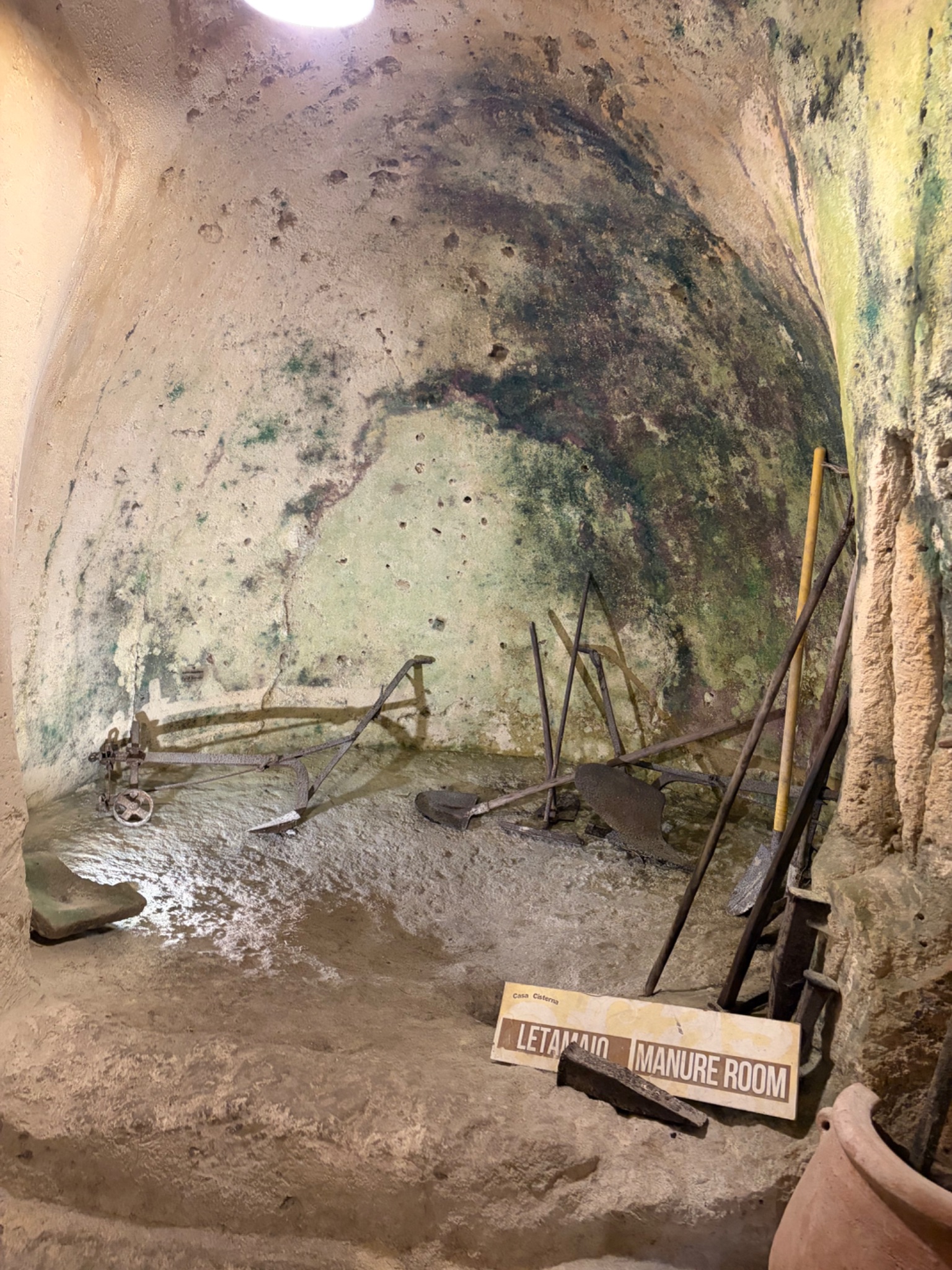 People lived in caves in the Sassi. They used decomposing manure to heat their homes - this is a manure pit!